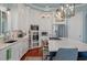 Bright kitchen featuring white cabinets, stainless steel appliances, a large island, and hardwood floors at 4935 Sound View Dr, Mount Pleasant, SC 29466