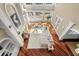 Aerial view of the living room featuring a fireplace, an open floorplan and gleaming hardwood floors at 4935 Sound View Dr, Mount Pleasant, SC 29466