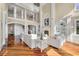 Spacious living room featuring a fireplace, an open floorplan and gleaming hardwood floors at 4935 Sound View Dr, Mount Pleasant, SC 29466