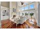 Elegant living room boasts high ceilings, a fireplace, and floor-to-ceiling windows showcasing beautiful views at 4935 Sound View Dr, Mount Pleasant, SC 29466