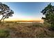 Scenic marsh view at sunset with golden light filtering across the landscape at 4935 Sound View Dr, Mount Pleasant, SC 29466