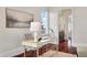 Bright home office with a large picture window and cherry wood floors at 4935 Sound View Dr, Mount Pleasant, SC 29466