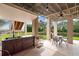 Inviting outdoor kitchen with ample seating, sink, and nature views at 4935 Sound View Dr, Mount Pleasant, SC 29466