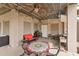 Inviting outdoor patio area with string lights, fan, grill and comfortable seating at 4935 Sound View Dr, Mount Pleasant, SC 29466