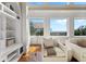 Bright seating area featuring built-in shelves, a comfortable chair, and a large window with a scenic view at 4935 Sound View Dr, Mount Pleasant, SC 29466