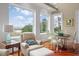 Comfortable seating area features lots of light with views of the water and a dining area at 4935 Sound View Dr, Mount Pleasant, SC 29466