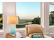 Cozy seating area with a tranquil view of the water from the window, creating a peaceful atmosphere at 4935 Sound View Dr, Mount Pleasant, SC 29466
