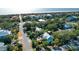 A coastal neighborhood featuring beach access and houses with pools, palm trees, and outdoor living spaces at 5 25Th Ave, Isle of Palms, SC 29451