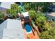Aerial view of a home featuring a pool, outdoor bar, hot tub, and palm trees at 5 25Th Ave, Isle of Palms, SC 29451
