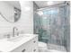 Elegant bathroom features a glass enclosed shower with rainfall showerhead and modern vanity at 5 25Th Ave, Isle of Palms, SC 29451