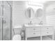Modern bathroom with double vanity, updated fixtures, and a glass-enclosed shower at 5 25Th Ave, Isle of Palms, SC 29451