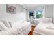 Bright bedroom with hardwood floors, two twin beds, and cozy decor at 5 25Th Ave, Isle of Palms, SC 29451