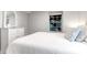 Comfortable bedroom featuring a white dresser, window, and a neatly made bed with beach-themed decorative pillows at 5 25Th Ave, Isle of Palms, SC 29451