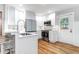 Bright kitchen featuring an eat-in bar, stainless steel appliances, and ample natural light at 5 25Th Ave, Isle of Palms, SC 29451