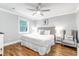 Comfortable main bedroom offers a king bed, stylish decor, and hardwood flooring at 5 25Th Ave, Isle of Palms, SC 29451