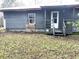 A single-story home features a quaint porch and a cozy backyard at 5056 Butler St, North Charleston, SC 29406