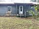 Exterior of a single-story home featuring a quaint porch and a cozy backyard at 5056 Butler St, North Charleston, SC 29406