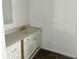 Bathroom with light countertops, custom cabinetry, and gold fixtures at 5056 Butler St, North Charleston, SC 29406