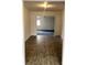 A bright and open living room featuring hardwood flooring and a view into another room at 5056 Butler St, North Charleston, SC 29406