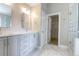 Bathroom with double sinks and marble countertop, and a walk in closet at 506 Cecilia Cove Dr, Charleston, SC 29412