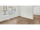 Bright bedroom with hardwood floors and a large window offering ample natural light and outdoor views at 506 Cecilia Cove Dr, Charleston, SC 29412