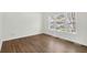 Bright bedroom with hardwood floors and a large window offering ample natural light and outdoor views at 506 Cecilia Cove Dr, Charleston, SC 29412