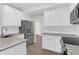 Modern kitchen with white cabinets, stainless steel appliances, and granite countertops at 506 Cecilia Cove Dr, Charleston, SC 29412