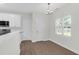Eat-in kitchen with white cabinets, stainless steel appliances, and natural light at 506 Cecilia Cove Dr, Charleston, SC 29412