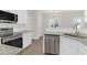 Modern kitchen featuring stainless steel appliances, granite countertops, and white cabinetry at 506 Cecilia Cove Dr, Charleston, SC 29412