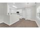Open floor plan with a bright white kitchen and eat-in area at 506 Cecilia Cove Dr, Charleston, SC 29412