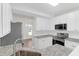Well-lit kitchen with white cabinetry, stainless steel appliances, and granite counters at 506 Cecilia Cove Dr, Charleston, SC 29412