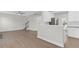 Open floor plan showcasing the living room and bright kitchen with stainless steel appliances at 506 Cecilia Cove Dr, Charleston, SC 29412