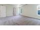 Large main bedroom features carpeted floor, an entry door, and ensuite bathroom at 506 Cecilia Cove Dr, Charleston, SC 29412