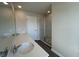 Bathroom featuring double sinks, quartz counters, and a glass-enclosed shower at 5122 Double Eagle, Summerville, SC 29485