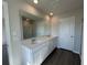 Bathroom with double sink vanity, a large mirror, and walk-in shower at 5122 Double Eagle, Summerville, SC 29485