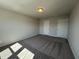 Spacious bedroom with neutral carpet, a ceiling light, and two doors at 5122 Double Eagle, Summerville, SC 29485