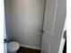 Powder room with commode and white door at 5122 Double Eagle, Summerville, SC 29485