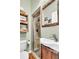 Bathroom features modern sink, glass shower and rustic wood vanity at 5219 Maybank Hwy, Wadmalaw Island, SC 29487
