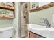 This bathroom features modern fixtures, including a sleek sink and updated shower at 5219 Maybank Hwy, Wadmalaw Island, SC 29487