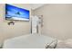 Bedroom features large TV screen and door to the outside at 5219 Maybank Hwy, Wadmalaw Island, SC 29487