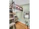 Bedroom features loft bed with rustic decor and wood floors at 5219 Maybank Hwy, Wadmalaw Island, SC 29487