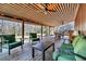 Spacious covered deck with comfortable seating and scenic views at 5219 Maybank Hwy, Wadmalaw Island, SC 29487