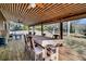 Spacious covered deck featuring a large wooden dining table at 5219 Maybank Hwy, Wadmalaw Island, SC 29487