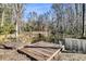 Rustic wooden dock extends over a pond with calm water, offering a peaceful retreat at 5219 Maybank Hwy, Wadmalaw Island, SC 29487