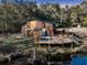 Quaint home features a deck with a hot tub overlooking the water at 5219 Maybank Hwy, Wadmalaw Island, SC 29487