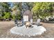Outdoor fire pit and seating area with view of shed at 5219 Maybank Hwy, Wadmalaw Island, SC 29487