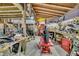 Spacious garage featuring exposed rafters, equipment, and shelving at 5219 Maybank Hwy, Wadmalaw Island, SC 29487