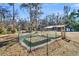 Fenced garden area with raised beds, offering ample space for growing vegetables at 5219 Maybank Hwy, Wadmalaw Island, SC 29487