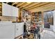 Utility room with washer, dryer, built in shelving, and access door to the outdoor deck at 5219 Maybank Hwy, Wadmalaw Island, SC 29487