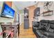 Stylish living area featuring a TV and a sleek kitchen with modern appliances at 5219 Maybank Hwy, Wadmalaw Island, SC 29487
